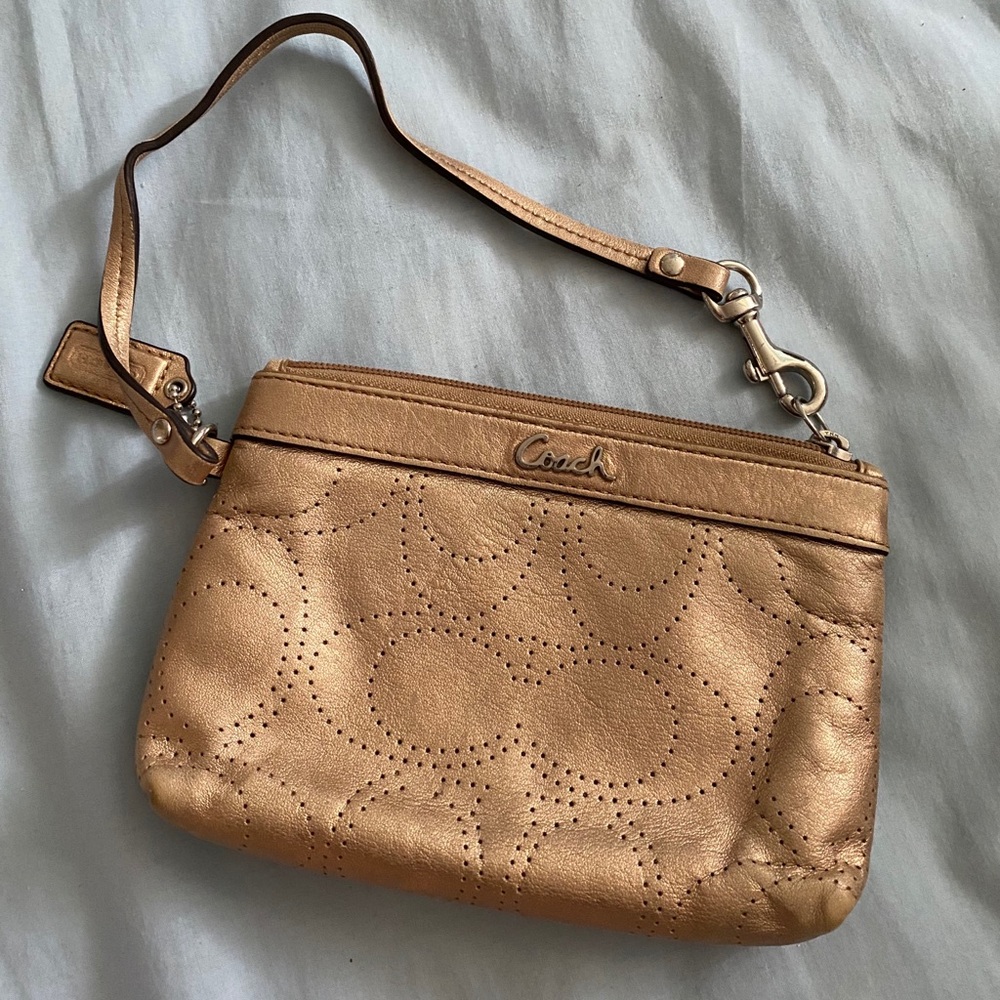 gold COACH wristlet pouch